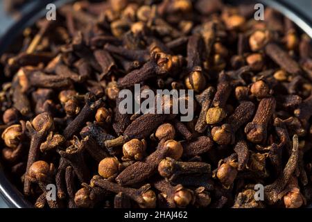 Dry Organic Whole Cloves in a Bowl Stock Photo