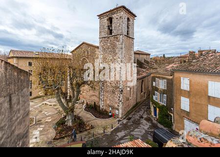View of the rear side of the Saint-Pancrace church (L'église Saint-Pancrace), which was built from 1489 to 1503 in the Provençal Gothic style with a renaissance façade in Aups, France Stock Photo