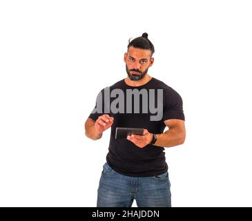Attractive muscular man using electronic tablet in studio Stock Photo