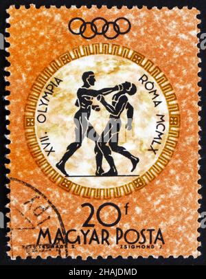 HUNGARY - CIRCA 1960: a stamp printed in the Hungary shows Boxers, Summer Olympic sports, Rome 60, circa 1960 Stock Photo