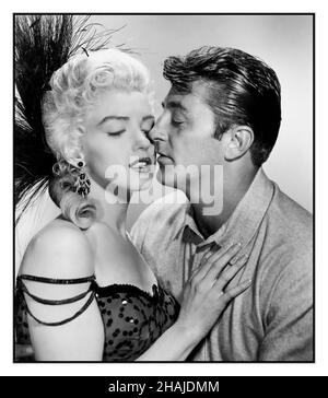 RIVER OF NO RETURN Vintage Film Movie Publicity still of 'River Of No Return' starring Robert Mitchum, Marilyn Monroe 1954  copyright with 20th Century Fox. River of No Return is a 1954 American Western film directed by Otto Preminger and starring Robert Mitchum and Marilyn Monroe. The screenplay by Frank Fenton is based on a story by Louis Lantz, who borrowed his premise from the 1948 Italian film Bicycle Thieves. The picture was shot on location in the Canadian Rockies in Technicolor and CinemaScope and released by 20th Century Fox. Stock Photo