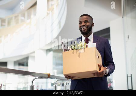 Happy african american young man with working stuff Stock Photo