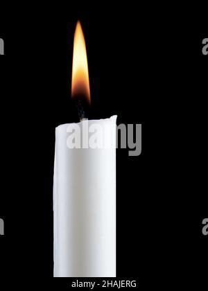 One candle burning brightly on black background Stock Photo