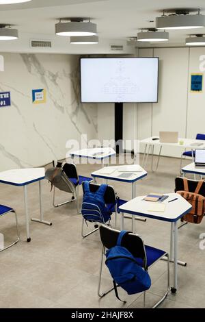 Vertical background image of programming classroom in modern school with code on screen, copy space Stock Photo