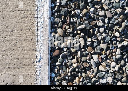 Concrete texture with crack in full screen as background. View from above Stock Photo