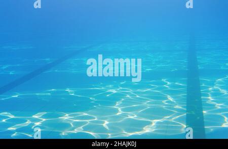 Empty swimming pool, dark lanes marks visible floor, underwater photo Stock Photo
