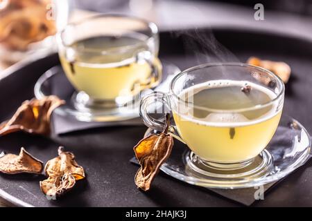 Whiskey drink Hot Teddy with dried pears. Mulled wine flavored with cloves and orange peel. Stock Photo