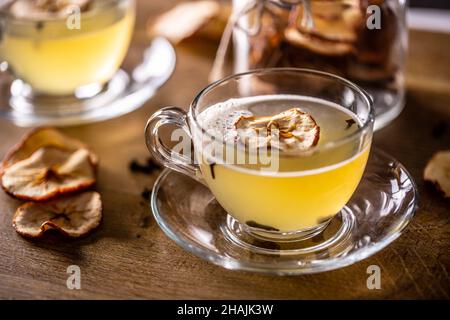 Whiskey drink Hot Apple Teddy with dried apples and cloves. Stock Photo