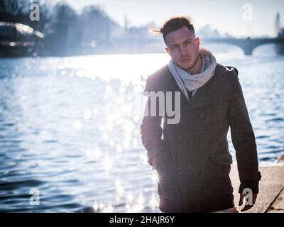 One handsome young man in urban setting in European city Stock Photo