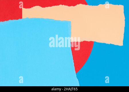 Torn paper textured collage background. Grunge ripped pastel paper pieces with ragged edge on geometric blue and red paper background Stock Photo