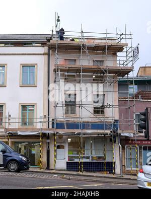 December 2021 - Work being carried out to the roof of a shop in Bristol, England, UK., Stock Photo