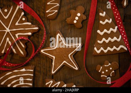 Christmas Cookies and Red Polka Dot Ribbon on wooden table Stock Photo