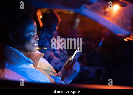 Premium Photo  Boyfriend sits engrossed in playing online games on his  smartphone, ignoring his girlfriend waiting.