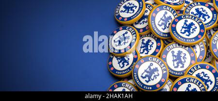 Logos of the English Soccer Club Chelsea FC on a heap on a table. Copy space. Web banner format Stock Photo