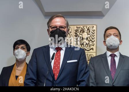 Prague, Czech Republic. 13th Dec, 2021. Marketa Pekarova Adamova chairman of TOP09 party, Petr Fiala new Czech Prime minister, Vit Rakusan chairman of STAN party (from left to right) are seen during a press conference. New Czech Prime minister Petr Fiala, leader of coalition SPOLU and chairman of ODS party, meets with Czech president Milos Zeman. Petr Fiala announced at a press conference that members of new government will be appointed this Friday by the president. (Photo by Tomas Tkacik/SOPA Images/Sipa USA) Credit: Sipa USA/Alamy Live News Stock Photo