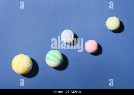 Different bath bombs on blue background Stock Photo