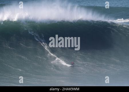 Nazare, Portugal. 12th Dec, 2021. Big wave surfer Kai Lenny from Hawaii competes during the Tudor Nazare Tow Surfing Challenge at Praia do Norte in Nazare, Portugal on December 12, 2021. (Credit Image: © Pedro Fiuza/ZUMA Press Wire) Credit: ZUMA Press, Inc./Alamy Live News Stock Photo