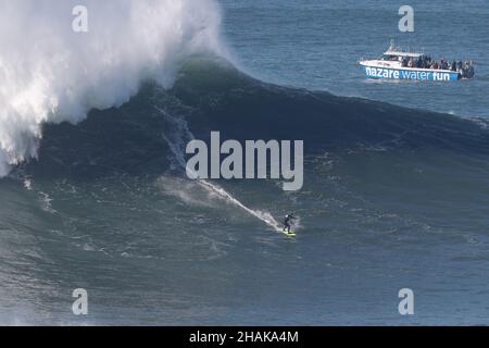 Nazare, Portugal. 12th Dec, 2021. Big wave surfer Maya Gabeira from Brazil competes during the Tudor Nazare Tow Surfing Challenge at Praia do Norte in Nazare, Portugal on December 12, 2021. (Credit Image: © Pedro Fiuza/ZUMA Press Wire) Credit: ZUMA Press, Inc./Alamy Live News Stock Photo