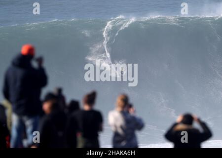 Nazare, Portugal. 12th Dec, 2021. Big wave surfer Pedro Scooby from Brazil competes during the Tudor Nazare Tow Surfing Challenge at Praia do Norte in Nazare, Portugal on December 12, 2021. (Credit Image: © Pedro Fiuza/ZUMA Press Wire) Credit: ZUMA Press, Inc./Alamy Live News Stock Photo