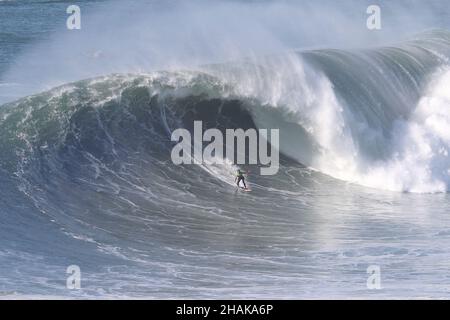 Nazare, Portugal. 12th Dec, 2021. Big wave surfer Justine Dupont from France competes during the Tudor Nazare Tow Surfing Challenge at Praia do Norte in Nazare, Portugal on December 12, 2021. (Credit Image: © Pedro Fiuza/ZUMA Press Wire) Credit: ZUMA Press, Inc./Alamy Live News Stock Photo