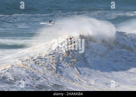 Nazare, Portugal. 12th Dec, 2021. Big wave surfer Kealii Mamala from Hawaii competes during the Tudor Nazare Tow Surfing Challenge at Praia do Norte in Nazare, Portugal on December 12, 2021. (Credit Image: © Pedro Fiuza/ZUMA Press Wire) Credit: ZUMA Press, Inc./Alamy Live News Stock Photo