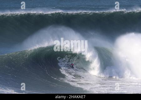 Nazare, Portugal. 12th Dec, 2021. Big wave surfer Kealii Mamala from Hawaii competes during the Tudor Nazare Tow Surfing Challenge at Praia do Norte in Nazare, Portugal on December 12, 2021. (Credit Image: © Pedro Fiuza/ZUMA Press Wire) Credit: ZUMA Press, Inc./Alamy Live News Stock Photo