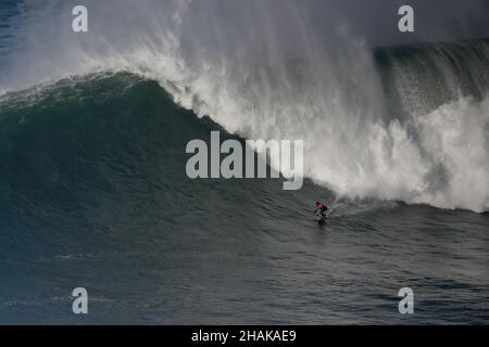 Nazare, Portugal. 12th Dec, 2021. Big wave surfer Kealii Mamala from Hawaii competes during the Tudor Nazare Tow Surfing Challenge at Praia do Norte in Nazare, Portugal on December 12, 2021. (Credit Image: © Pedro Fiuza/ZUMA Press Wire) Credit: ZUMA Press, Inc./Alamy Live News Stock Photo