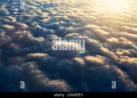 Dense clouds with sunlight . Spectacular clouds view from above Stock Photo