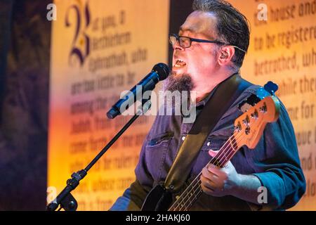 Bass guitarist, Miguel DeJesus, of Smalltown Poets during the Smalltown Poets Christmas Concert in Atlanta, Georgia. (USA) Stock Photo