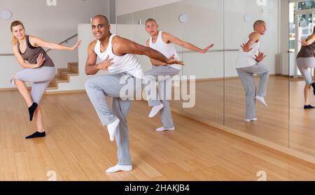 Group of multinational activity people practicing dance techniques Stock Photo
