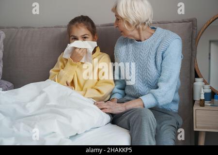 Lovely child not feeling well due to seasonal cold Stock Photo