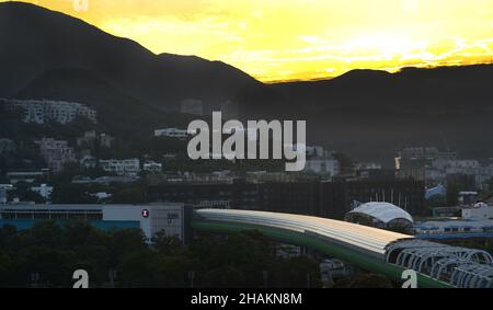 Sunrise over the Tai Tam mountain range in Hong Kong. Stock Photo