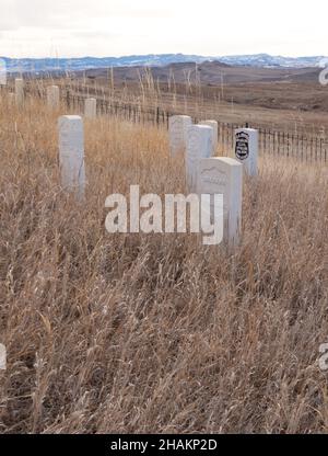 White marble tombstones marking graves of 7th Cavalrymen on Custer's Last Stand Hill at Little Bighorn Battlefield Stock Photo