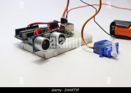 Ultrasonic distance sensor and a micro servo. Project showing application of electrical engineering with cables and controller Stock Photo
