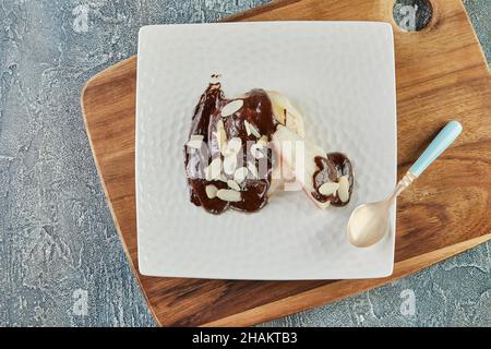 Dessert with pears, dark chocolate and almonds. French gourmet cuisine Stock Photo
