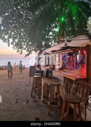 Na Jomtien Beach Pattaya Thailand December 2021, white tropical beach during sunset in Pattaya Najomtien at the Glasshouse famous restaurant Stock Photo