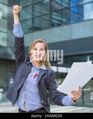 Professional woman in jacket working with documents Stock Photo