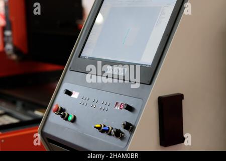 Control console of CNC laser cutting machine. Selective focus. Stock Photo