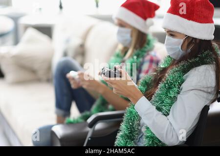 Friends have fun and playing video game using controlling joystick Stock Photo