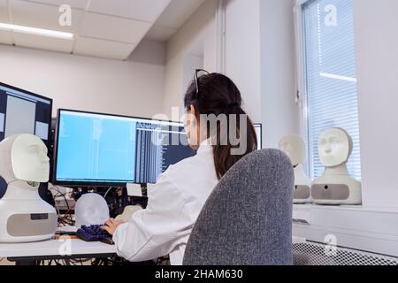 Female engineer sitting at work station Stock Photo