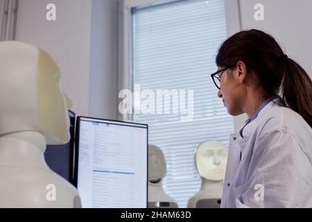 Female engineer working on computer Stock Photo