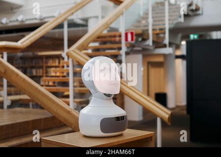 Robot voice assistant in library Stock Photo