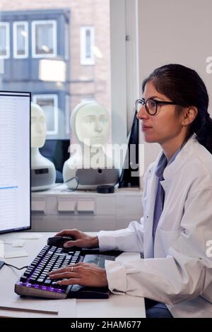 Female engineer working on computer Stock Photo