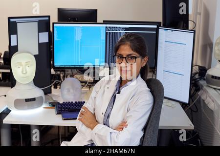 Portrait of female engineer at work station Stock Photo