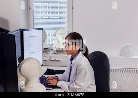 Female engineer working on computer Stock Photo