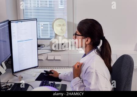 Female engineer working on computer Stock Photo