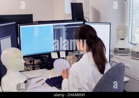 Female engineer working on robots Stock Photo