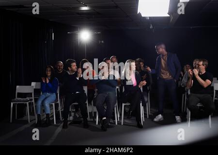 TV show host interviewing audience member Stock Photo