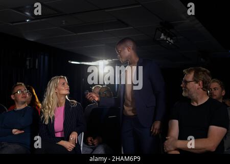 TV show host interviewing audience member Stock Photo