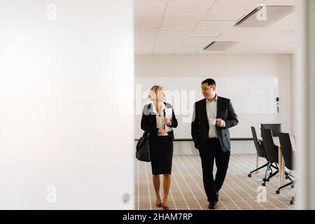 Businesspeople talking in office Stock Photo